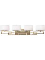 Lanza 4 Light Bath Sconce with Etched Opal Glass Shades in Brushed Bronze.